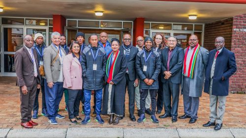 DHET and NSF officials with representatives from Orbit TVET College football team.