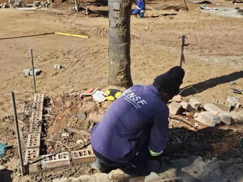 An NSF beneficiary gaining practical experience in concrete curing at K Boneng Skills Training