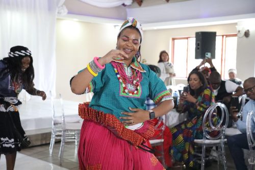 Official embracing the beauty of her culture.