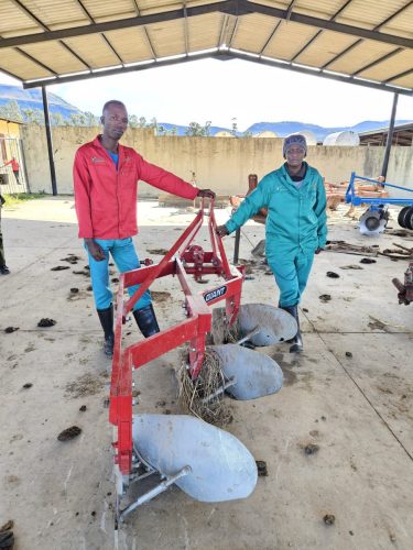 NSF beneficiaries beside training equipment 