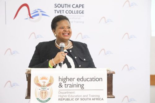 Deputy Minister making at the podium