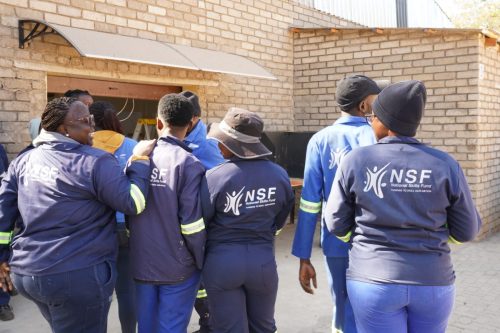 NSF beneficiaries huddle.