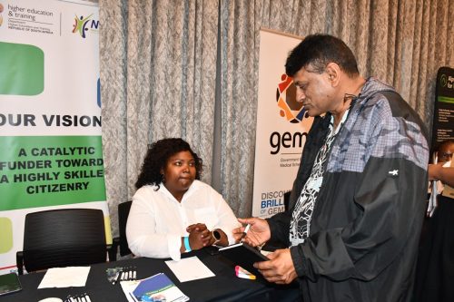 NSF official engaging a stakeholder at the convention