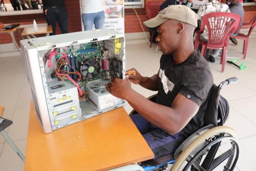 DYDS-technical-support-student-fixing-computer-hard-drive