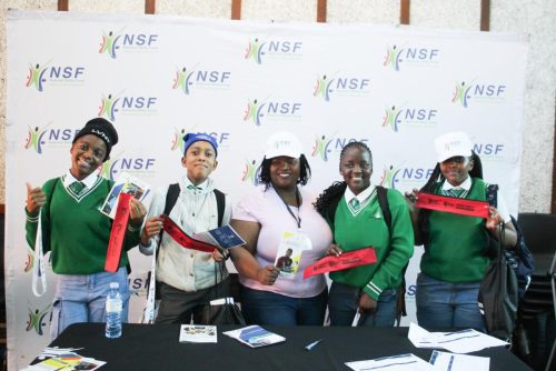 NSF Official with the learners at the exhibition.