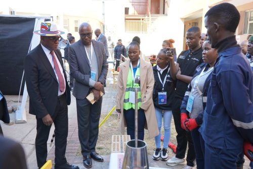 DHET Senior officials at the exhibition stalls.