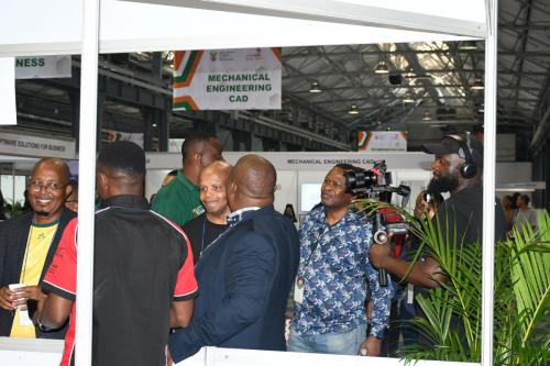 NSF World Skills Competitions 3 February 2024 Dr. Nkosinathi Sishi, Zukile Mvalo, and David Mabusela walking around competition stalls, Durban ICC