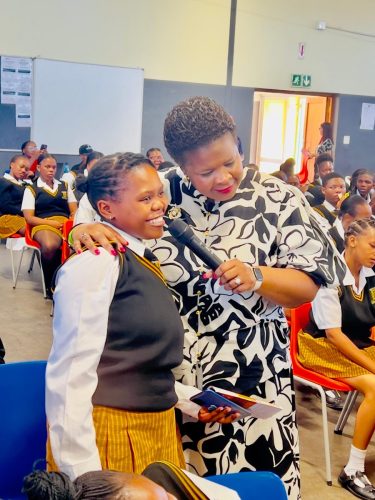 Dr Mimmy interac ts with a student.
